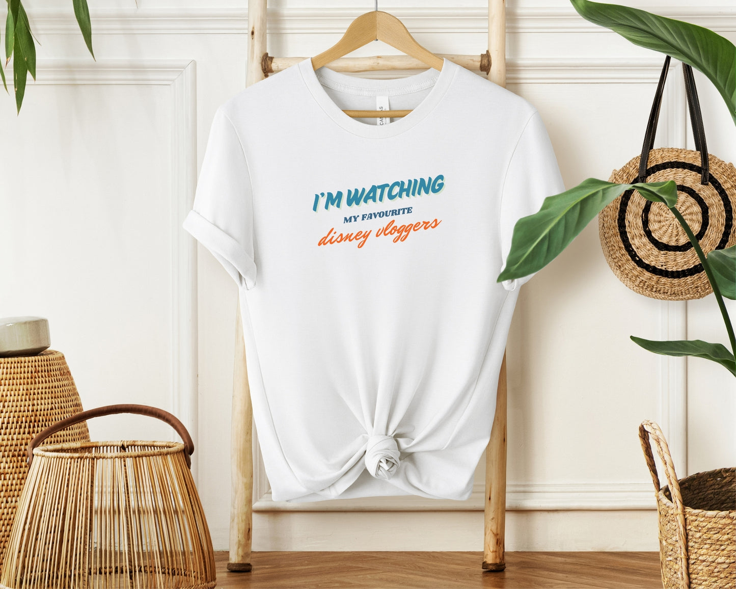 hanging bella and canvas 3001 in white with disney vloggers youtube print on chest