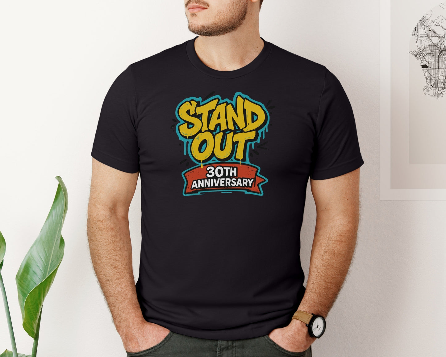 male model wearing Bella and Canvas 3001 t-shirt in black, with a Disney inspired 'stand out 30th anniversary' print on chest to celebrate the A Goofy Movie 30th anniversary