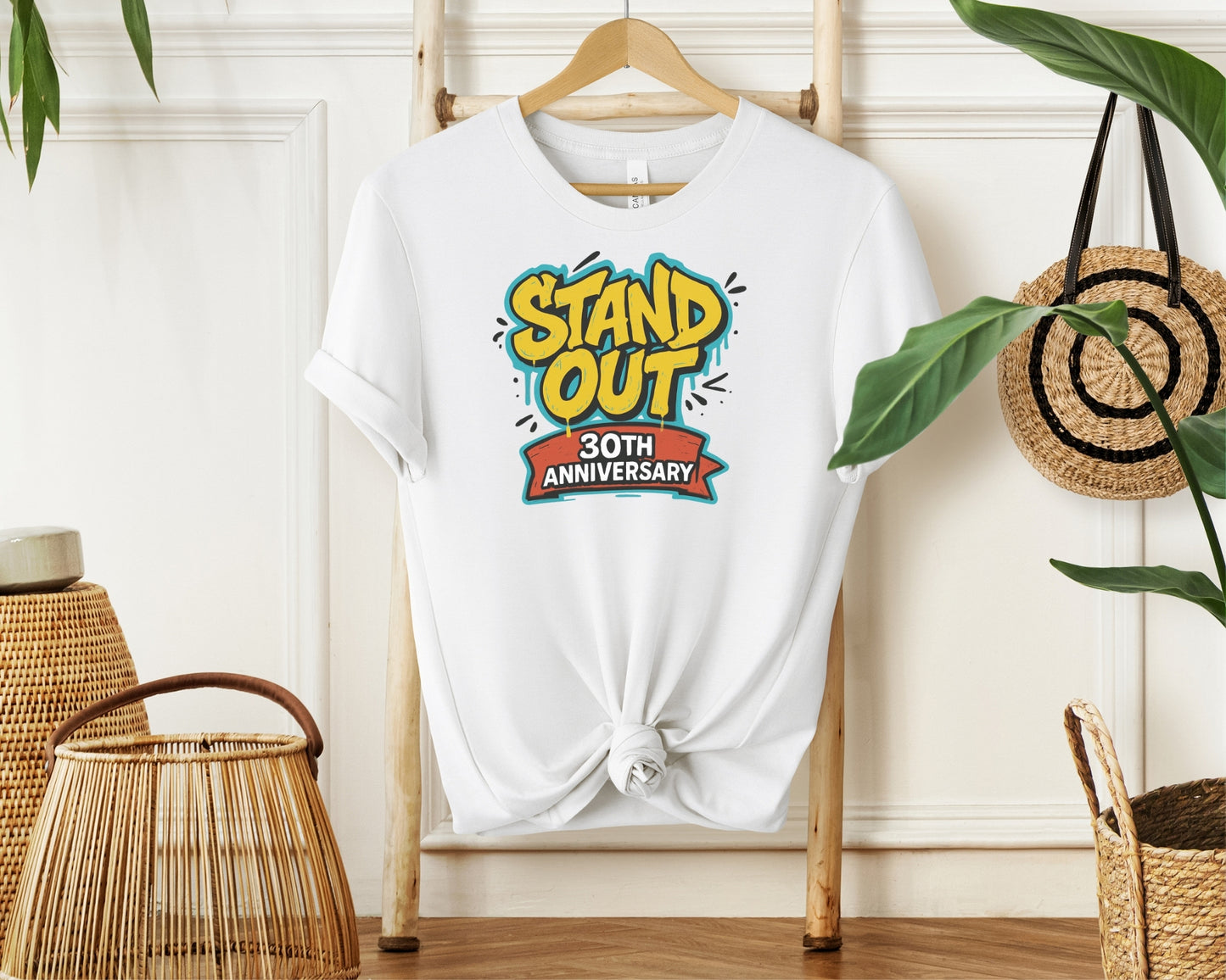 Hanging Bella and Canvas 3001 t-shirt in white, with a Disney inspired 'stand out 30th anniversary' print on chest to celebrate the A Goofy Movie 30th anniversary