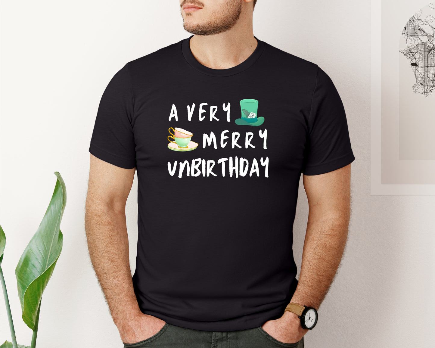 male model Bella and Canvas 3001 T-Shirt in black, with a disney/Alice in Wonderland inspired 'a very merry unbirthday' design on chest