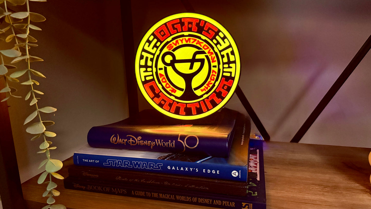 Ogas Cantina inspired LED light box glowing on shelf with Star Wars style circular sci fi design