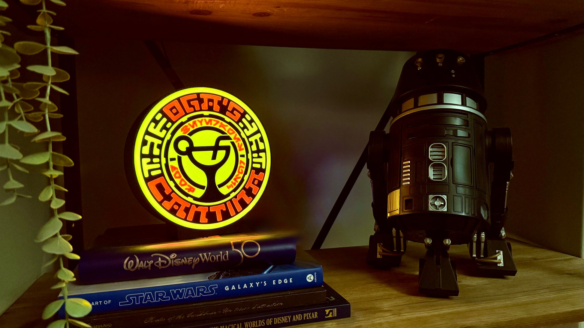 Ogas Cantina inspired LED light box glowing on shelf with Star Wars style circular sci fi design