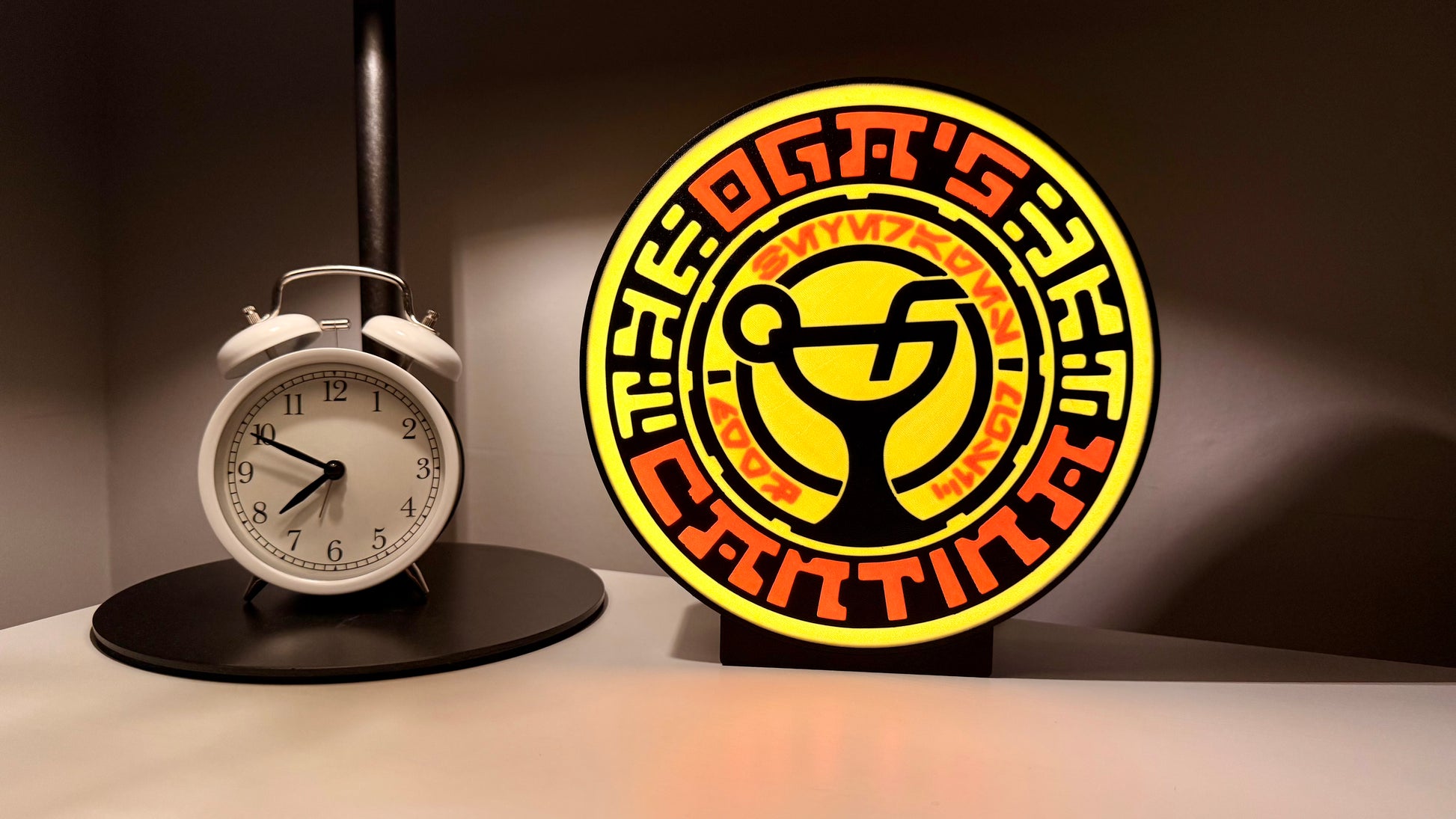 Ogas Cantina inspired LED light box glowing on shelf with Star Wars style circular sci fi design