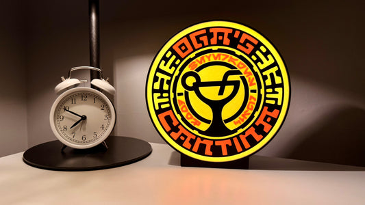 Ogas Cantina inspired LED light box glowing on shelf with Star Wars style circular sci fi design