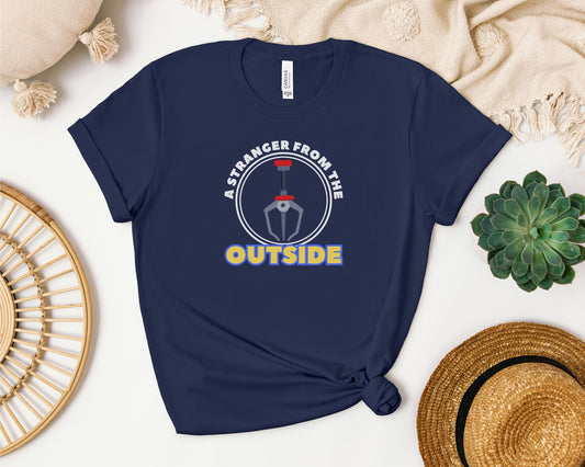 bella and canvas 3001 t-shirt laid flat in navy with 'a stranger from the outside' grabber claw graphic on chest inspired by Toy Story 