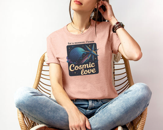 Female model wearing bella and canvas 3001 t-shirt in heather prism peach with Taylor Swift x Guardians Of The Galaxy, 'For a moment I knew cosmic love' print on chest Inspired by Disney World