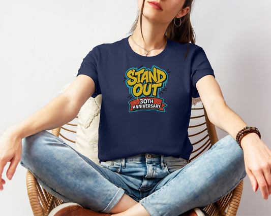 Female model wearing Bella and Canvas 3001 t-shirt in navy, with a Disney inspired 'stand out 30th anniversary' print on chest to celebrate A Goofy Movie's 30th anniversary 