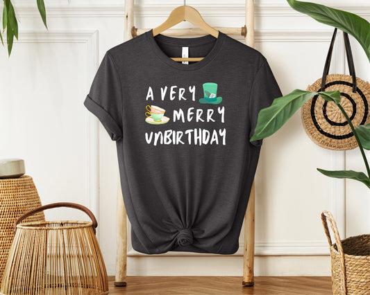 Hanging Bella and Canvas 3001 T-Shirt in dark grey heather, with a disney/Alice in Wonderland inspired 'a very merry unbirthday' design on chest 
