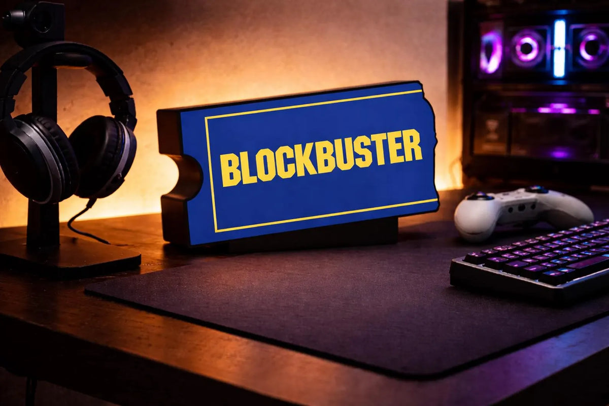 Blockbuster sign on a desk with gaming equipment